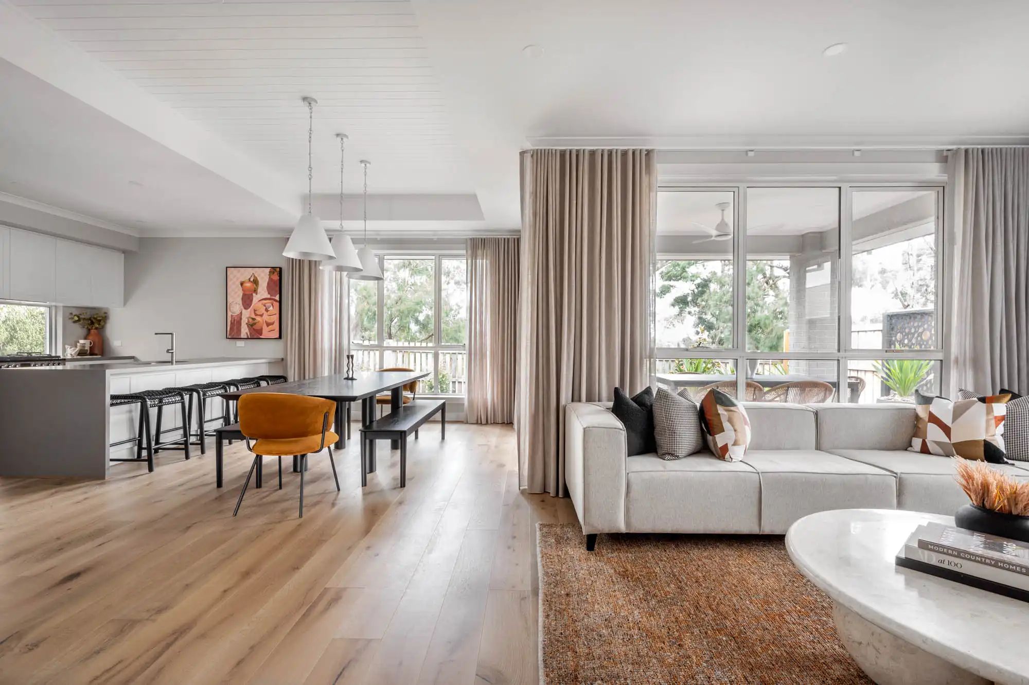 Raised wood cladding ceiling at the Nowra 26 for a feature in this open plan living concept