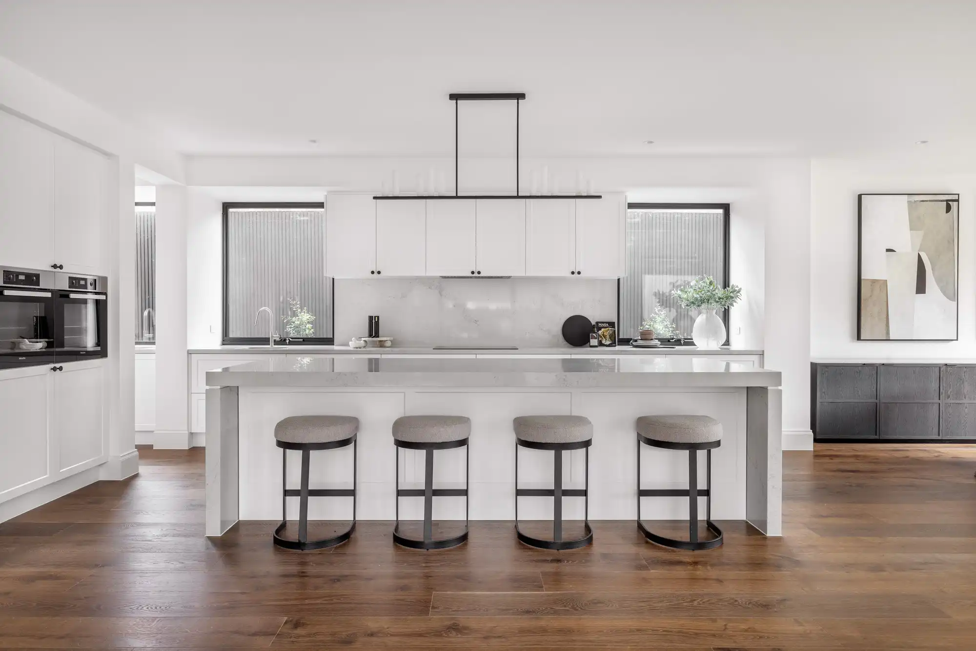 The Durrant Masterpiece home, with stone island beach tops, chestnut timber flooring to brighten up the netural coloured living