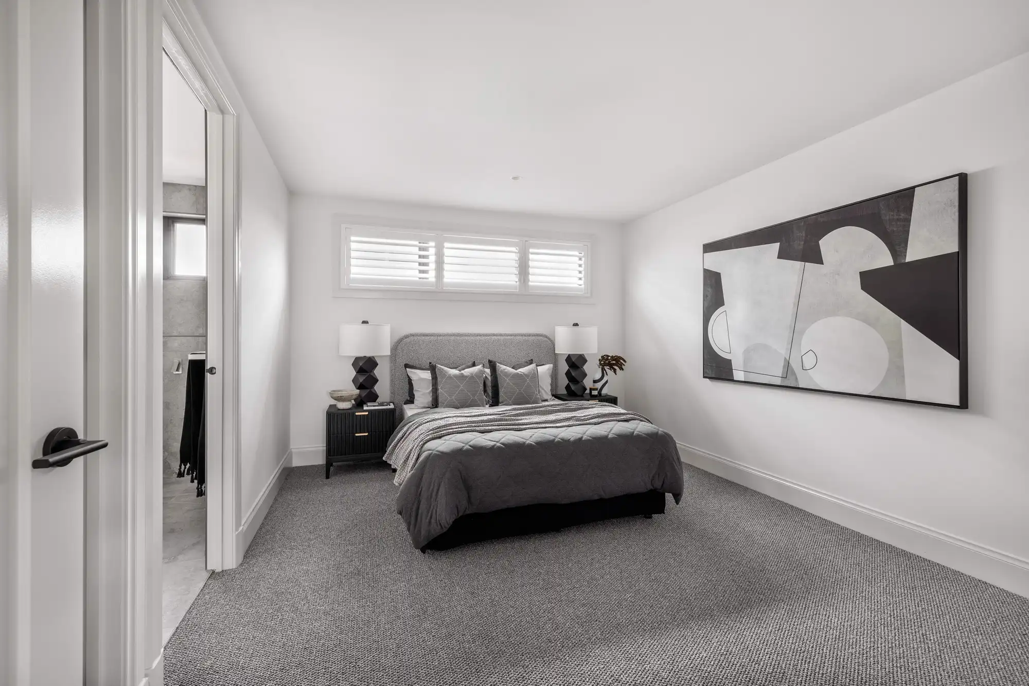 Ensuite bathroom at the Durrant Masterpiece home. Shutter blinds for sunlight.
