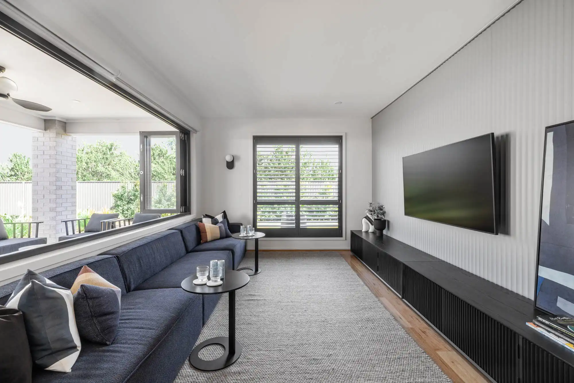 Cladding feature wall and bi fold windows that open up to the alfresco at the Victor 29 in Riverlea South Australia