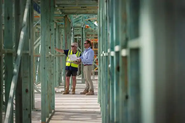 Builders evaluating a Simonds home