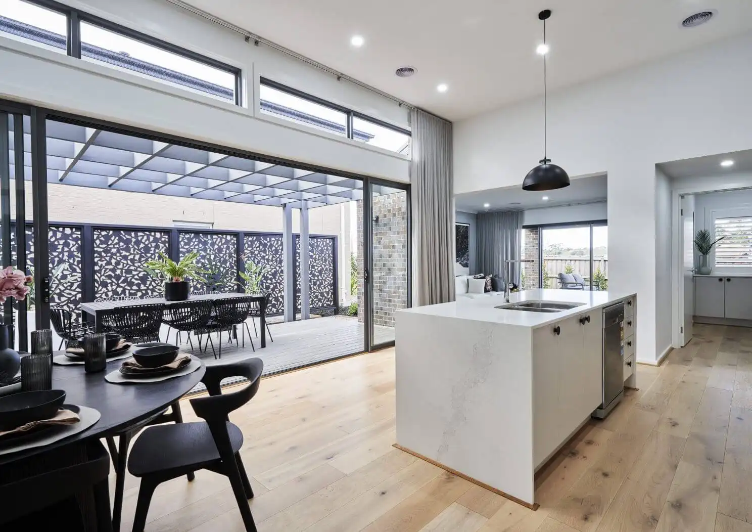 adding an alfresco that connects to the kitchen and living area with raked ceiling