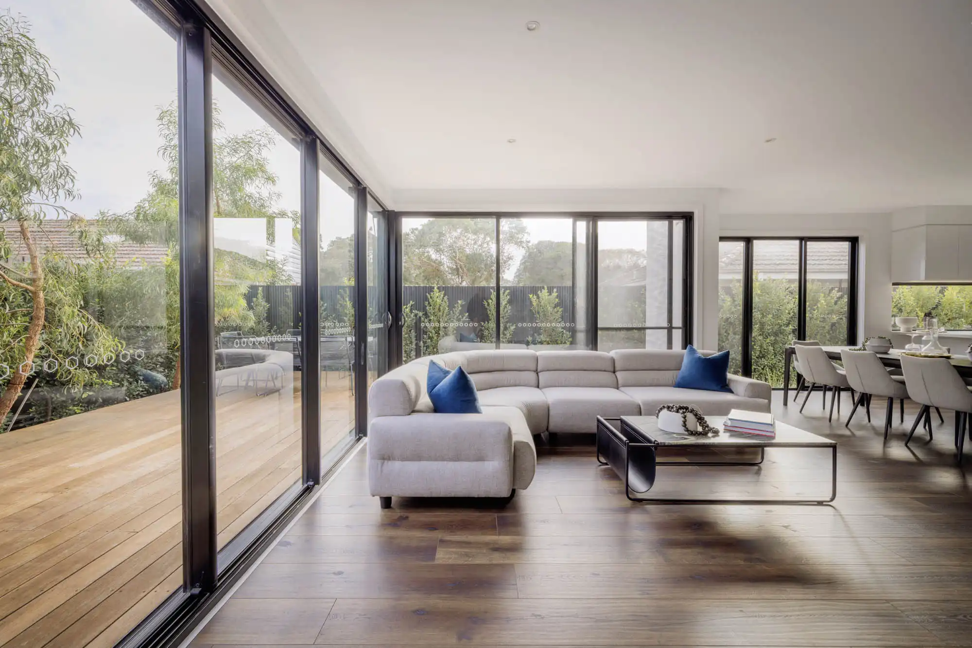 Timber decking and flooring flowing throughout the whole living space and alfresco at the Milford Masterpice home in Beaumaris