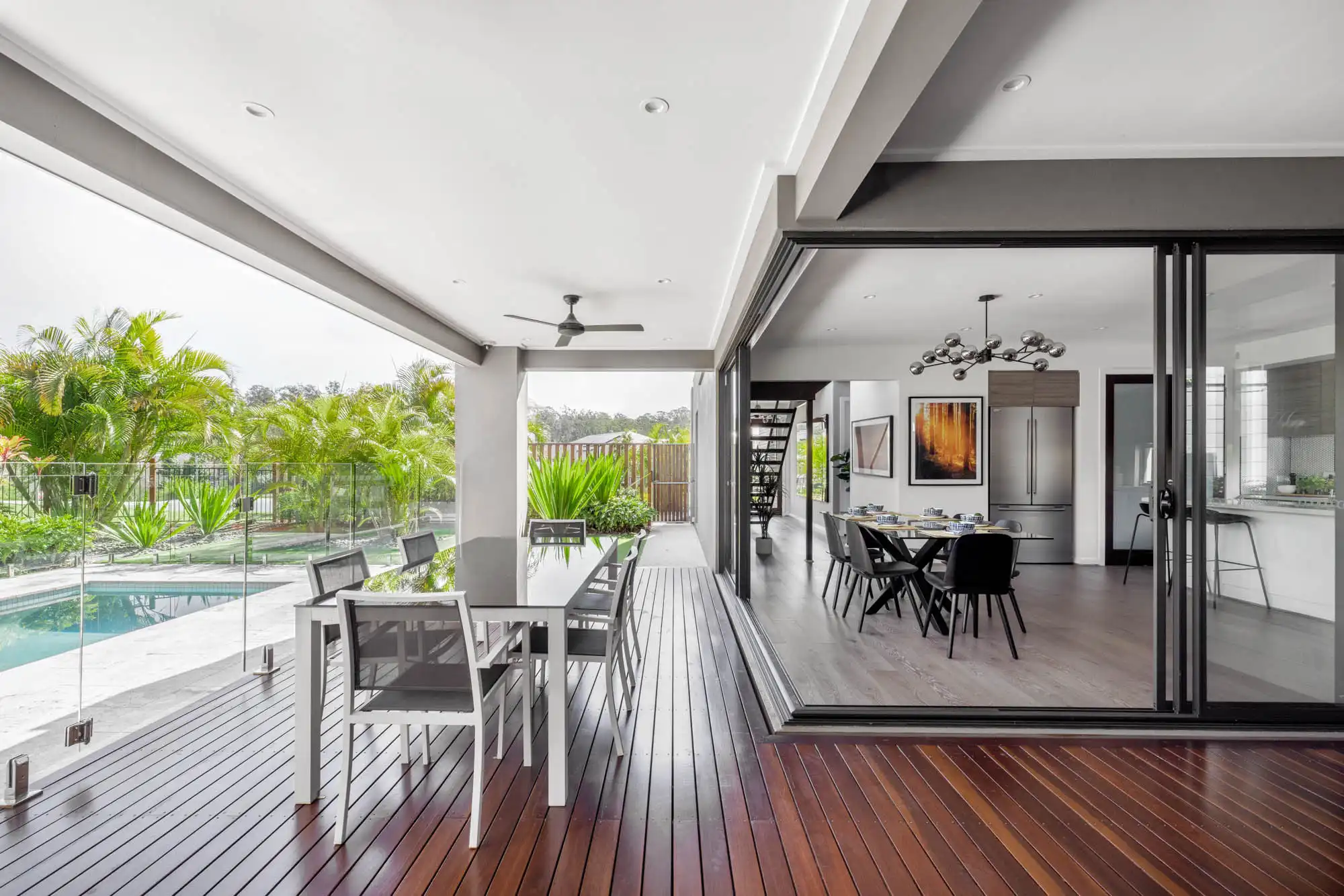 building a home with a pool and connecting a wraparound alfresco to dining area at the colston 26