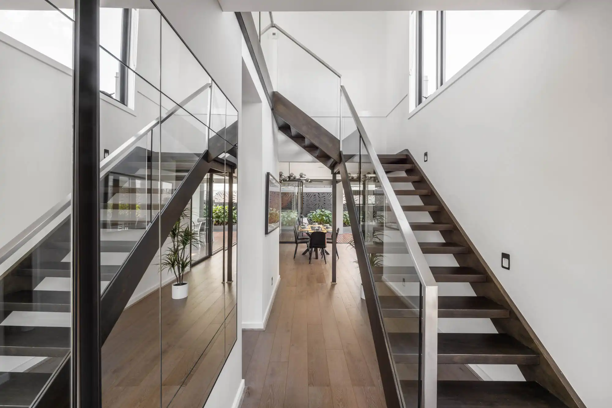 timber staircase with high ceilings and chrome railings at our colston 26