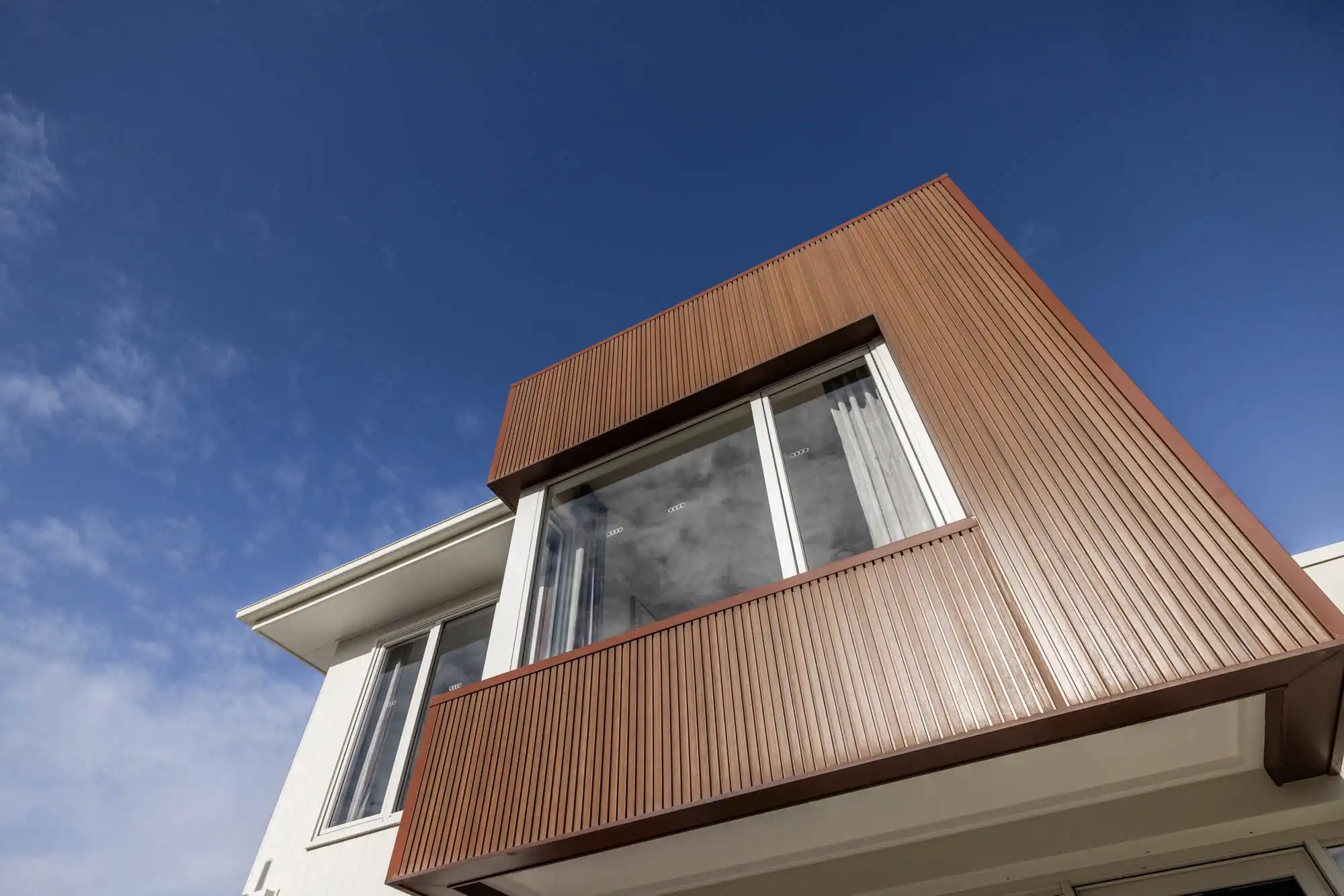 An exterior image of an upper level view of Travertine 31 home design.