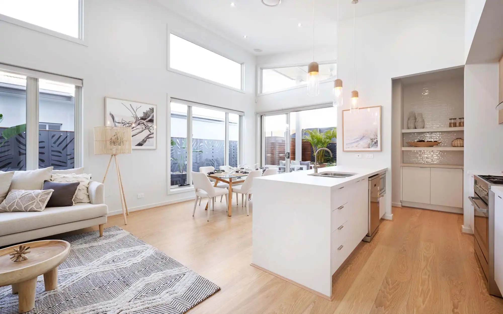 elevated skylight above kitchen butler's pantry and sliding doors that lead you into the alfresco