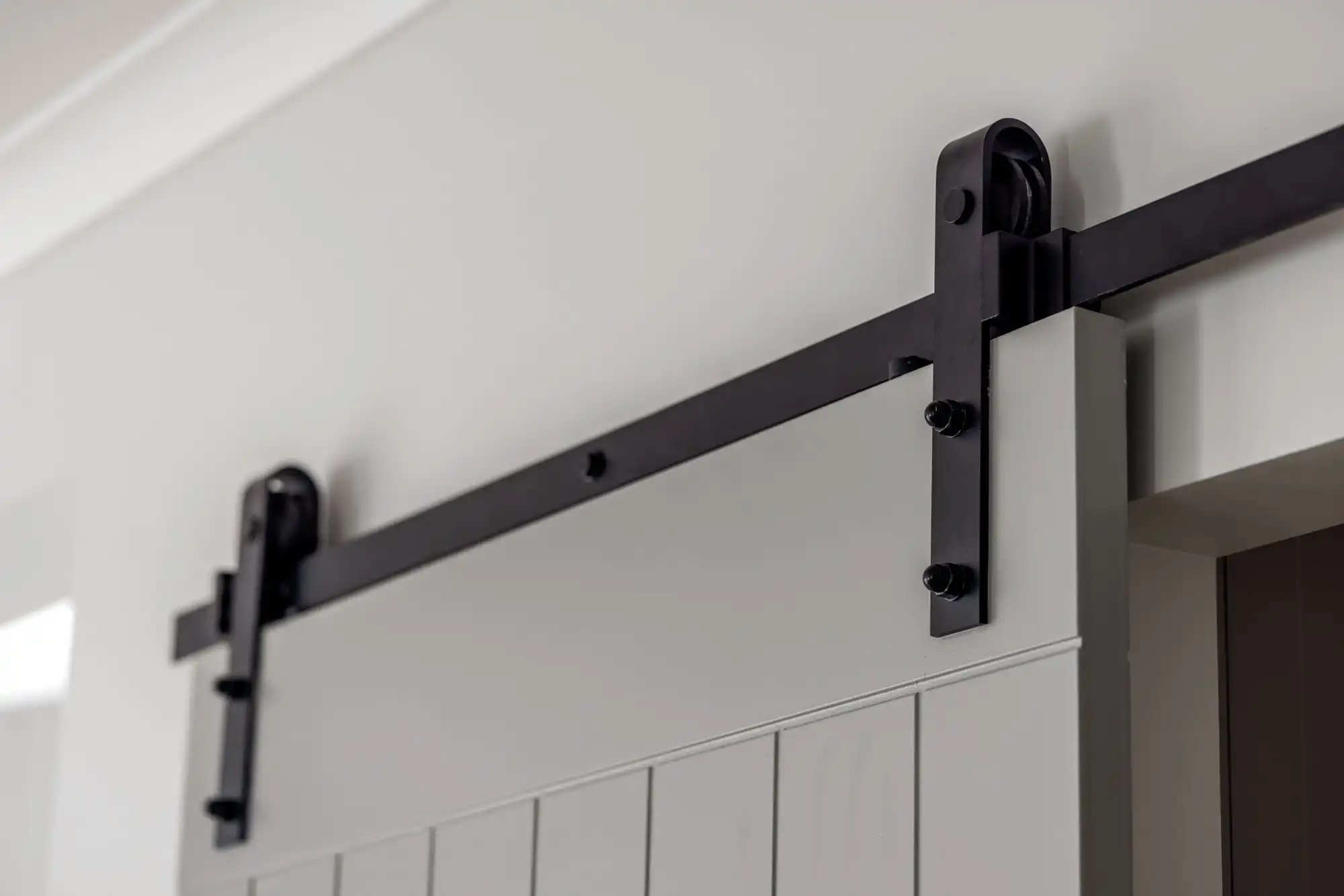 installing a barn-style door in your home for the butler's pantry with black detailing