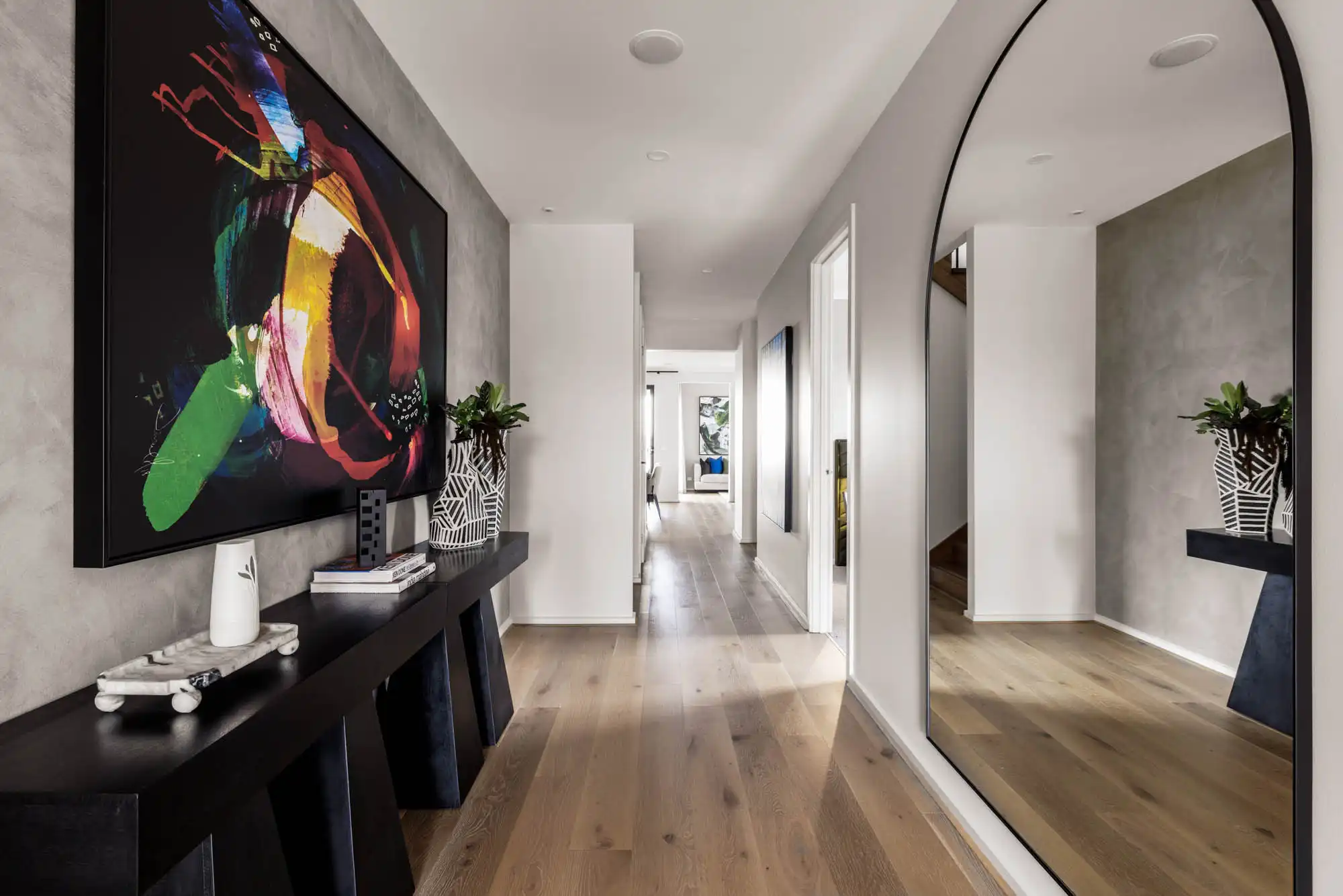 statement artwork and a featured coloured wall with a huge floor length mirror to open up the space of this armidale 34