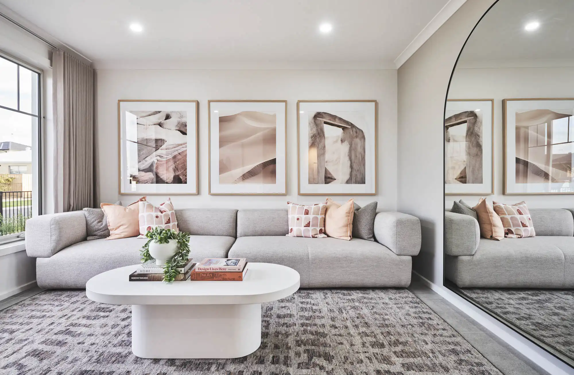 floor to ceiling mirrors with beige and grey neutral colours in second livign space