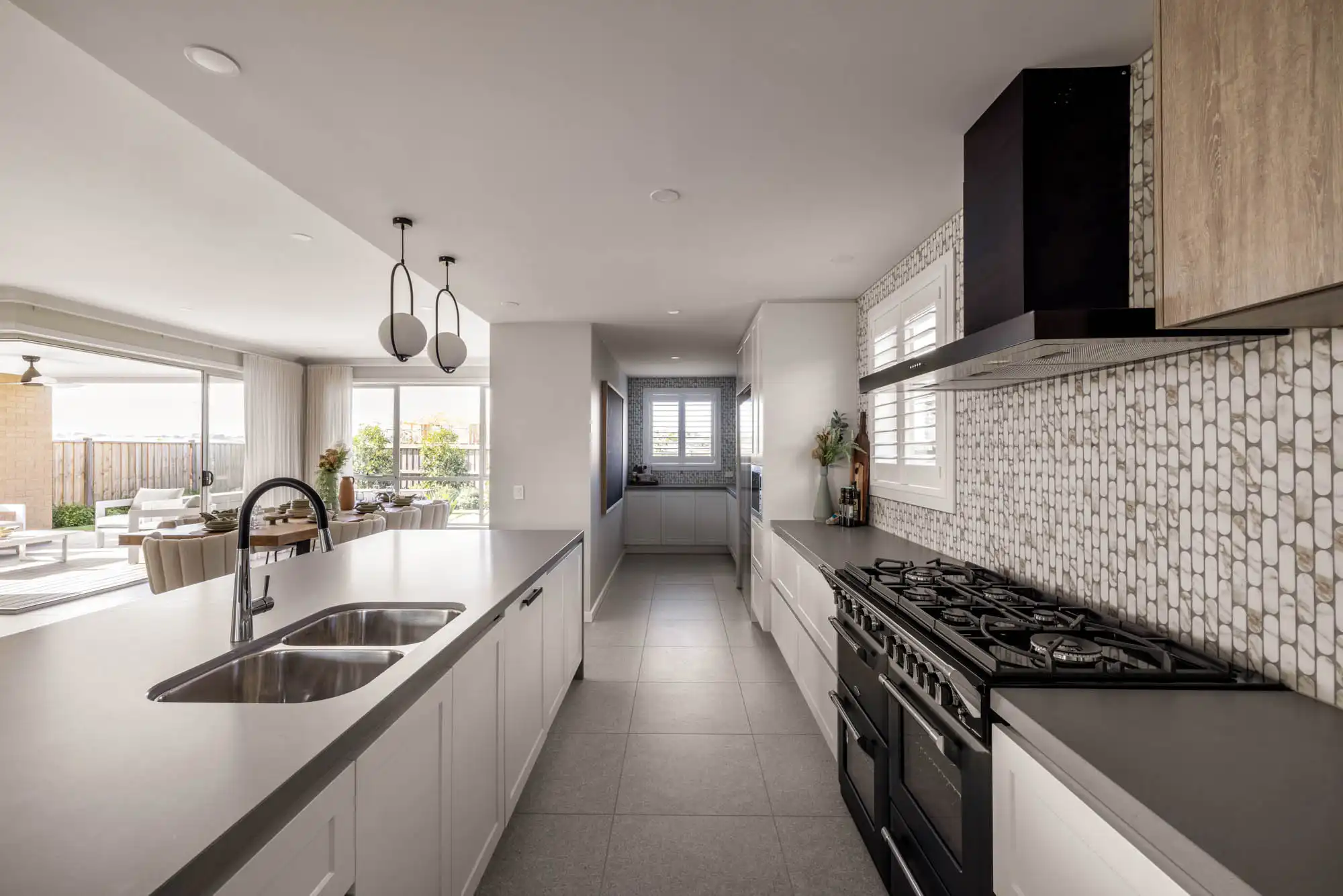 dream coastal kitchen design with mosaic tiling with timber cabinetry at tallowood 52