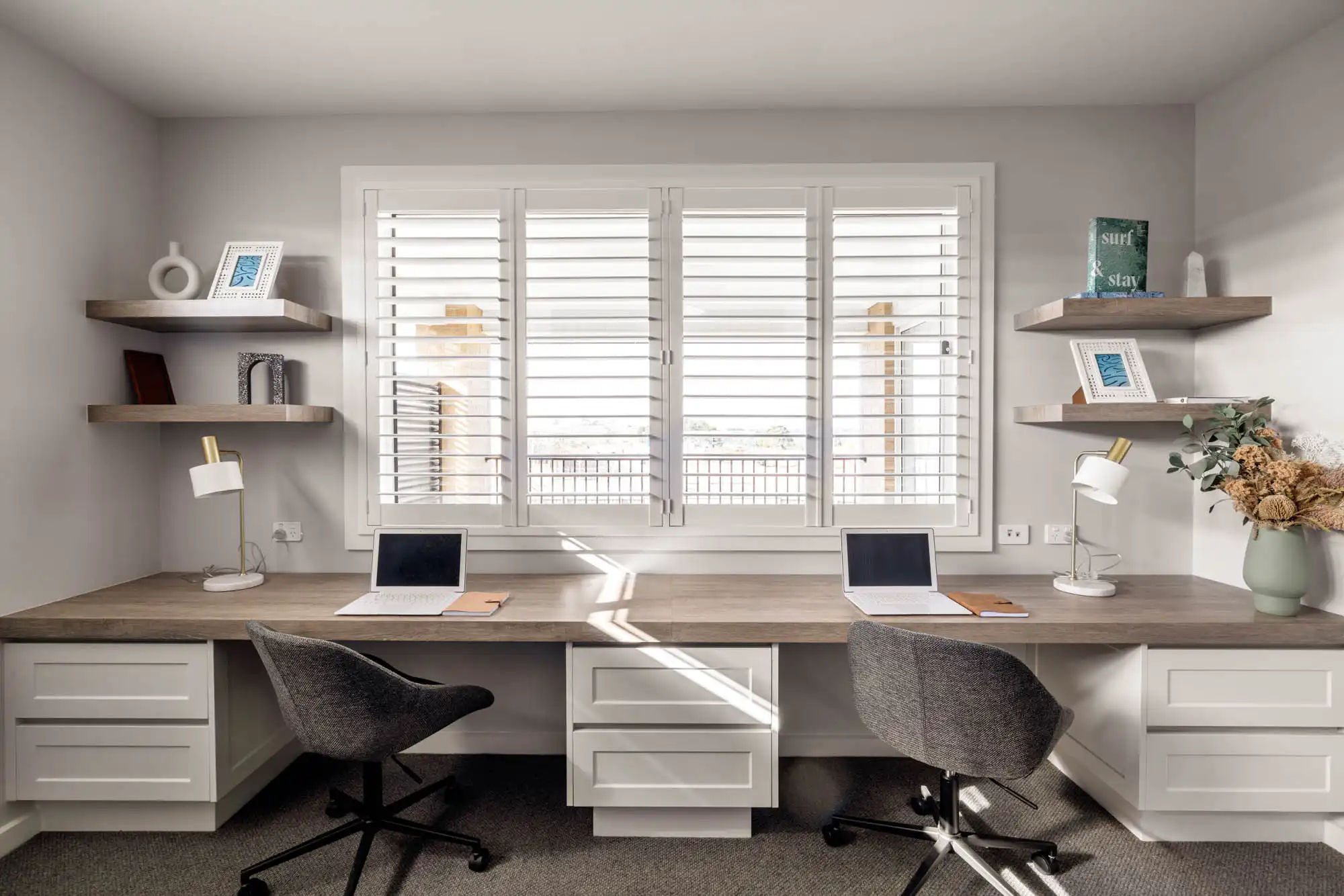 dual study spots with cabinetry and shelving built in and plantation shutters at the tallowood 52