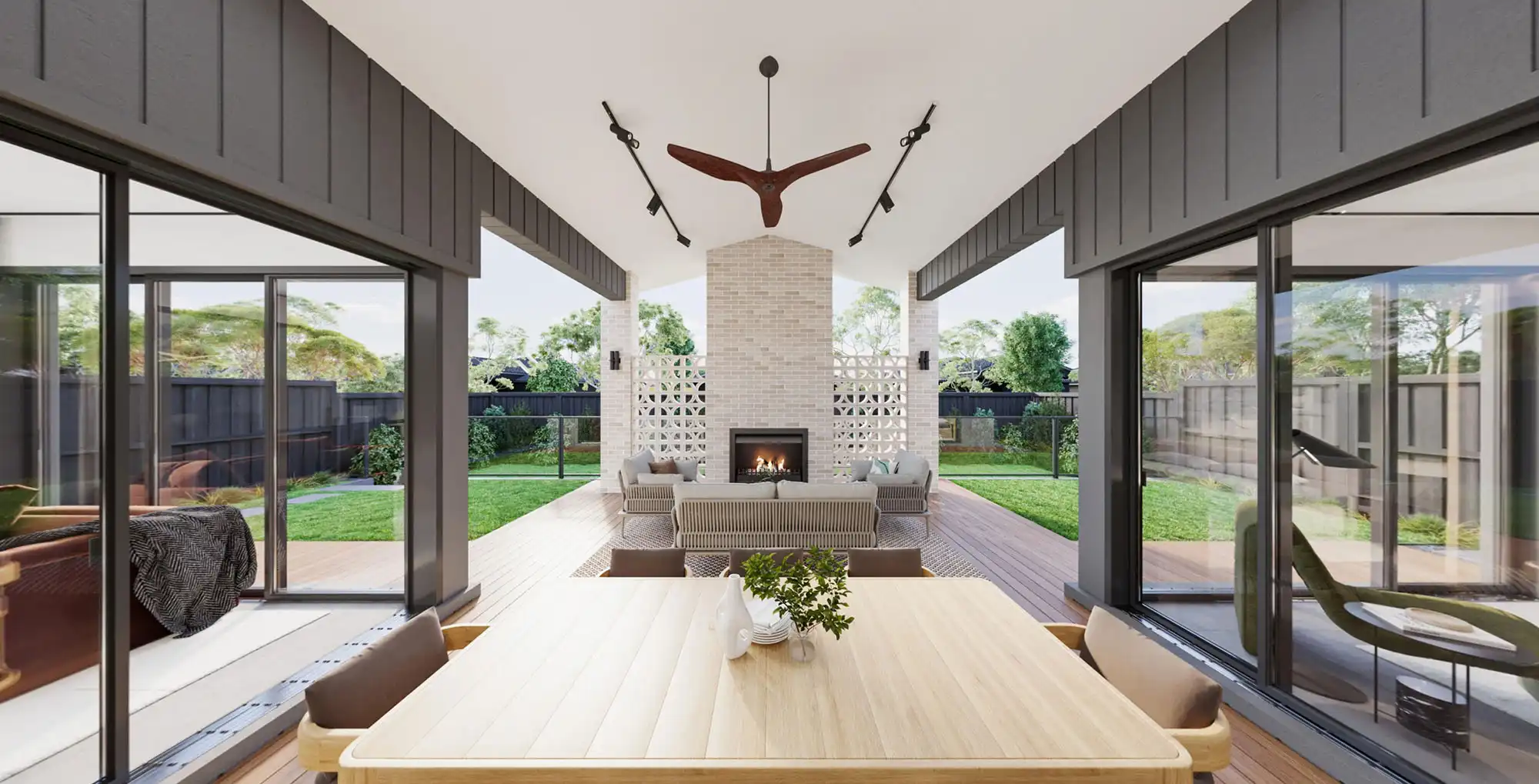 open plan alfresco with timber decking modern brick fireplace designed for entertainment at willandra 34