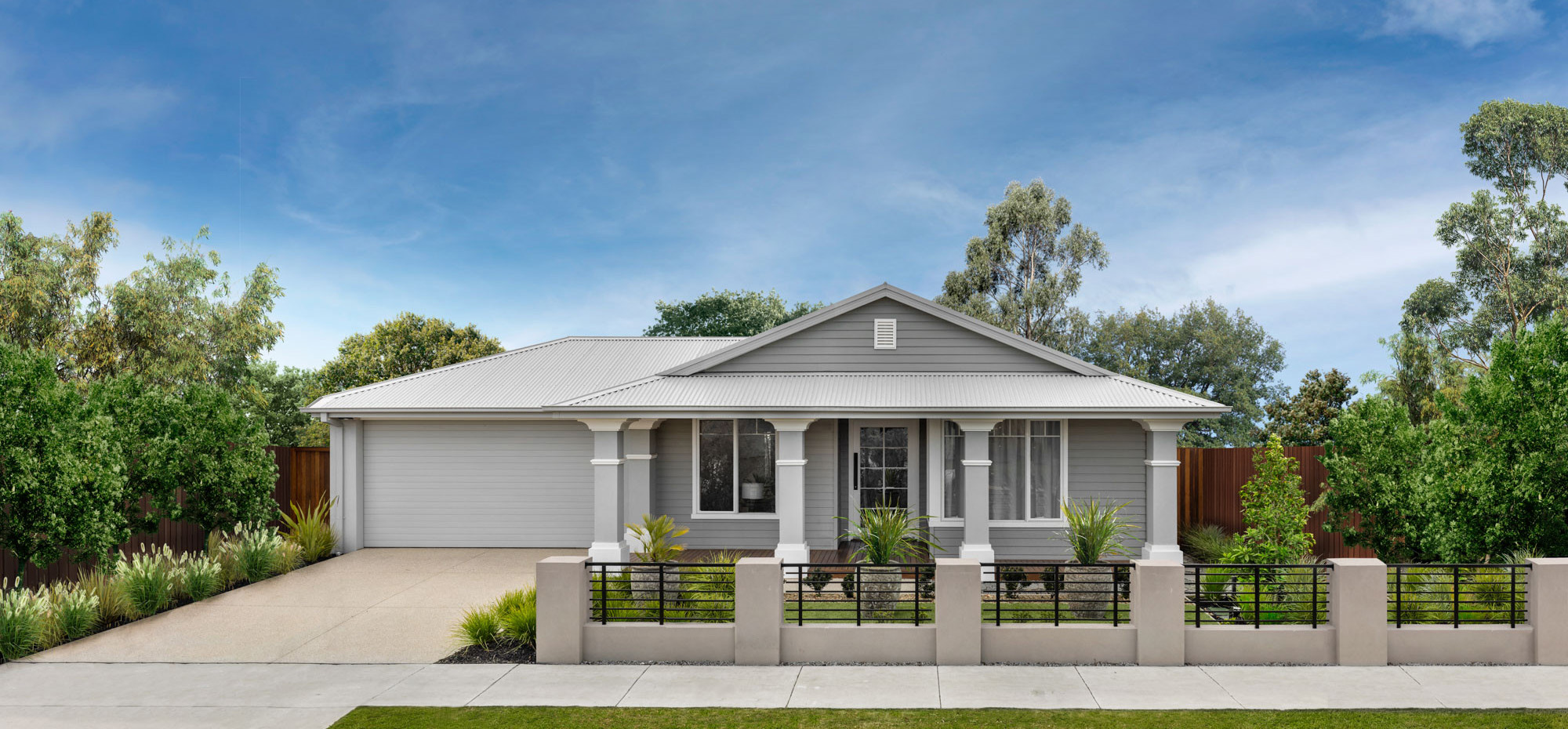 An exterior image of a single storey home with a garage space and a front yard as a part of Simonds Akuna 29 facade.